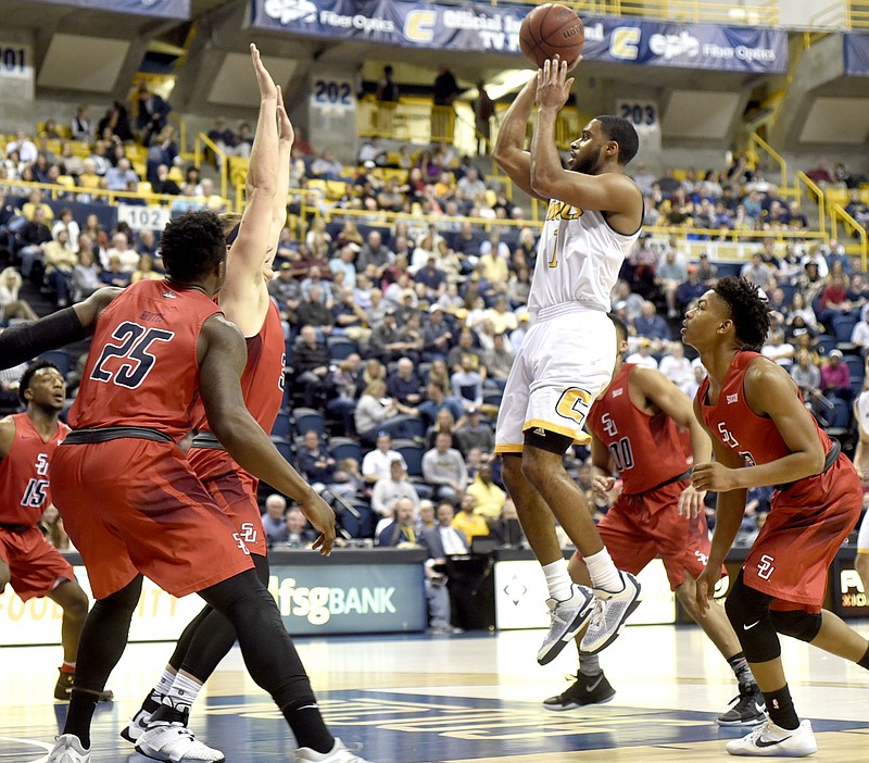 UTC's Greg Pryor (1) shoots surrounded by the entire Samford team.  The Samford Bulldogs visited the Chattanooga Mocs at McKenzie Arena in Southern Conference basketball action on January 20, 2017.  