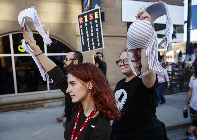 Women carry bras as they march in the Chattanooga Women's March on Saturday, Jan. 21, 2017, in Chattanooga, Tenn. Thousands of demonstrators marched locally from Coolidge Park to the Aquarium in solidarity with protesters in Washington D.C. and across the nation.