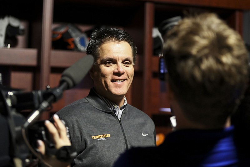 New Tennessee quarterbacks coach Mike Canales speaks to the media during an introductory news conference Friday night in Knoxville.