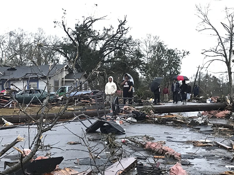 
              Trees and debris cover the ground after a tornado tornado ripped through the Hattiesburg, Miss.,  area early Saturday, Jan. 21, 2017.  Mayor Johnny DuPree has signed an emergency declaration for the city, which reported "significant injuries" and structural damage.  (Ryan Moore/WDAM-TV via AP)
            