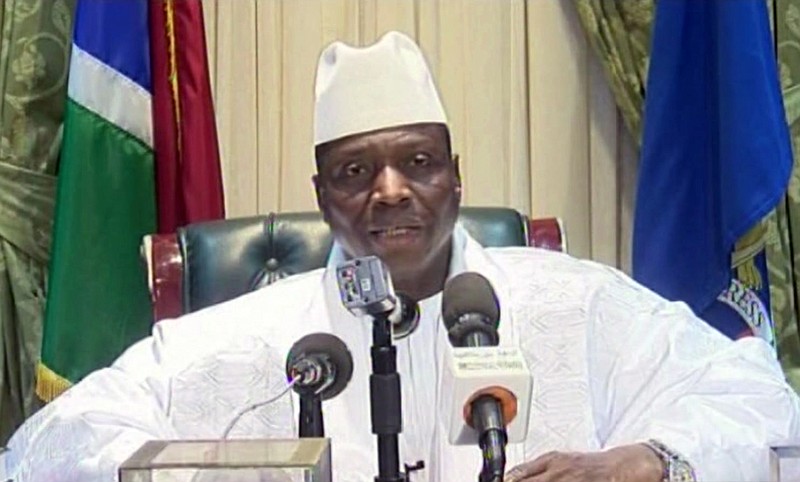 
              In this image taken from TV, Gambia's longtime leader Yahya Jammeh appears on state TV to give a brief statement agreeing to step down from office, in Banjul, Gambia, the early hours of Saturday morning Jan. 21, 2017.   Jammeh's decision to step down appears to pave the way for the winner of December's general elections, Adama Barrow to take power. (Gambia State TV via AP)
            