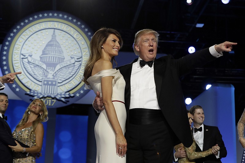 
              President Donald Trump acknowledges the crowd with first lady Melania Trump at the Freedom Ball, Friday, Jan. 20, 2017, in Washington. (AP Photo/Evan Vucci)
            