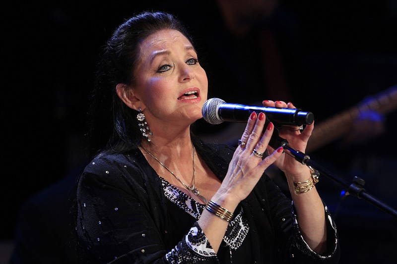 
              FILE - In this Oct. 21, 2012 file photo, Crystal Gayle performs at the Country Music Hall of Fame Inductions in Nashville, Tenn. Country music legend Gayle is being inducted into the Grand Ole Opry in Nashville, nearly a half-century after she first walked onto its stage to perform as a teenager. Gayle's sister, country luminary Loretta Lynn, will induct her into the country music institution during a Saturday night, Jan. 21, 2017, ceremony at the Ryman Auditorium, the Grand Ole Opry announced. (Photo by Wade Payne/Invision/AP, File)
            