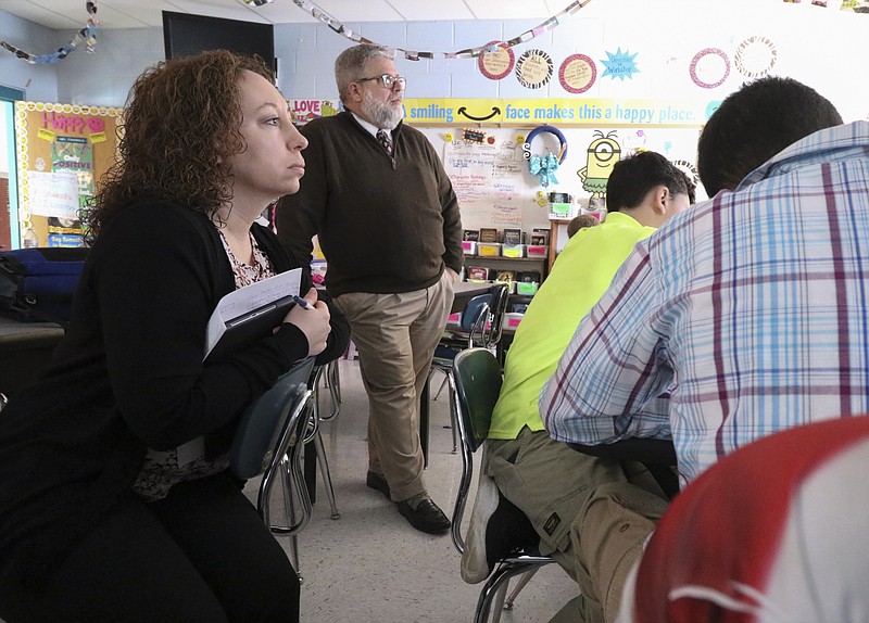 Staff Photo by Dan Henry / The Chattanooga Times Free Press- 1/18/17. Red Bank Middle School Principal Andrea Edmondson, left, and HMS Principal Robert Alford visit a sixth grade English class during a principal's professional development training session at Hunter Middle School on January 18, 2016. Educators visited reading and writing classes to see how HMS teachers blend them into the social studies curriculum.