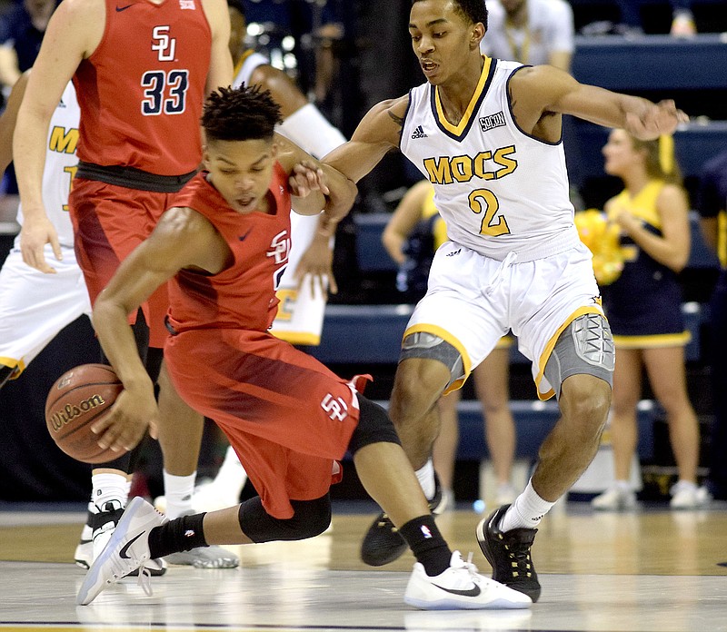 UTC's Rodney Chatman pressures Samford's Josh Sharkey into losing control of the ball during Saturday's SoCon matchup at McKenzie Arena, which the Mocs won 82-78.