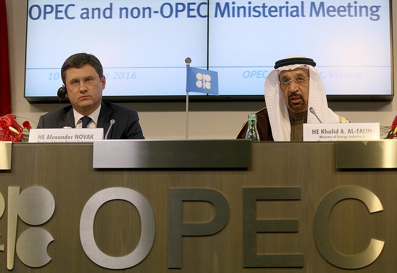 
              FILE  - In this Saturday, Dec. 10, 2016 file photo, Russian Minister of Energy Alexander Novak, left, and Khalid Al-Falih, Minister of Energy, Industry and Mineral Resources of Saudi Arabia attend a news conference after a meeting of the Organization of the Petroleum Exporting Countries, OPEC, at their headquarters in Vienna, Austria.  OPEC and key non-OPEC oil producers are near their target of taking 1.8 million barrels of crude a day off global markets less than two months after agreeing to do so in efforts to push up the price of crude, Russia's energy minister said Sunday, Jan. 22, 2017. Novak's upbeat comments to reporters came at the end of the first meeting of a joint OPEC-non-OPEC committee set up to monitor compliance to the Dec. 10 agreement. (AP Photo/Ronald Zak, FIle)
            
