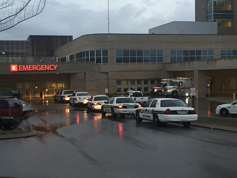 Police cars line the drive at Memorial Hospital.
