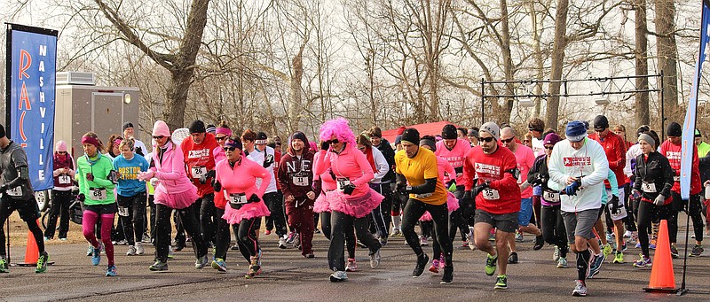 Runners race past the finish line at Nashville's Cupid's Chase 5k. Chattanooga will again host its version on Feb. 11.