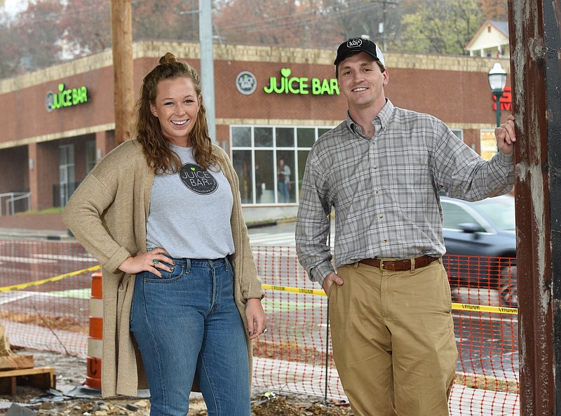 Asa Swift, right, operator of three new Juice Bar franchises in Chattanooga, stands with his North Market Street General Manager Hannah Snyder outside the soon-to-open Northshore location.