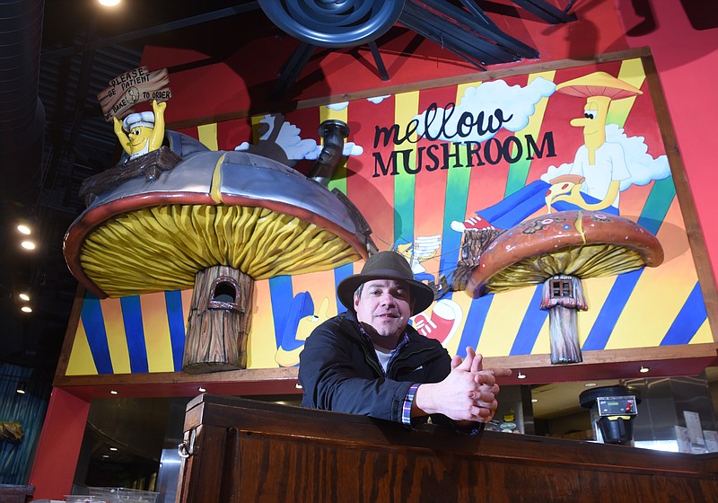 Jason Jones, a partner in the two Mellow Mushroom restaurants in Chattanooga, stands inside the Broad Street  location in downtown Chattanooga.