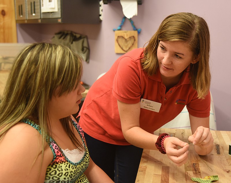 Brittany O'Dell, right, works with Alivia Ennis Wednesday, July 13, 2016, at the Creative Discovery Museum. O'Dell is working an internship through the Step-Up program.