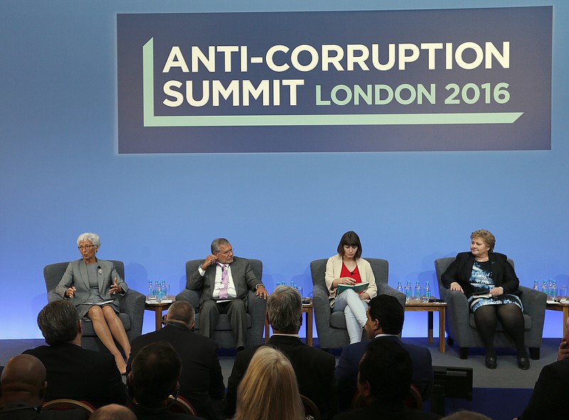 
              FILE - In this Thursday, May 12, 2016 file photo, Christine Lagarde, Managing Director of the International Monetary Fund, from left, Jose Ugaz, Transparency International, Daria Kaleniuk and Norway's Prime Minister Erna Solberg take part in a panel discussion at the Anti-Corruption Summit in London. Watchdog group Transparency International on Wednesday Jan. 25, 2017, is warning that people who turn to populist politicians who promise to change systems and end corruption may only be feeding the problem. (AP Photo/Frank Augstein, Pool, File)
            