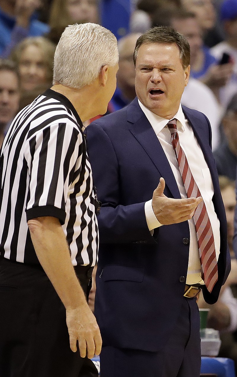 
              Kansas head coach Bill Self talks to an official during the first half of an NCAA college basketball game against Texas, Saturday, Jan. 21, 2017, in Lawrence, Kan. (AP Photo/Charlie Riedel)
            