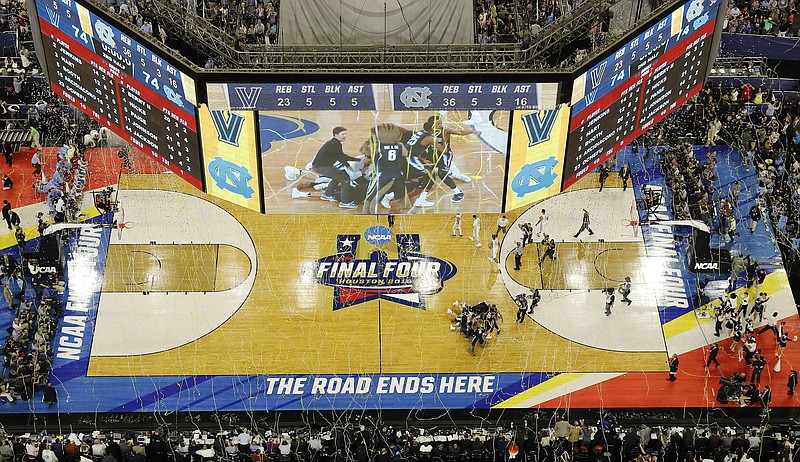 
              FILE - In this April 4, 2016, file photo, Villanova players collapse on the court after they defeated North Carolina  77 in the championship game of the NCAA Final Four college basketball tournament in Houston. The selection committee for the NCAA men’s basketball tournament is getting into the bracketology business and borrowing an idea from the College Football Playoff, hoping it will get more fans thinking about March Madness in February. The NCAA and CBS Sports announced Tuesday, Jan. 24, 2017, that for the first time the committee will give a look at its top 16 seeds one month before the 68-team field locks in on March 12. (AP Photo/Morry Gash, File)
            