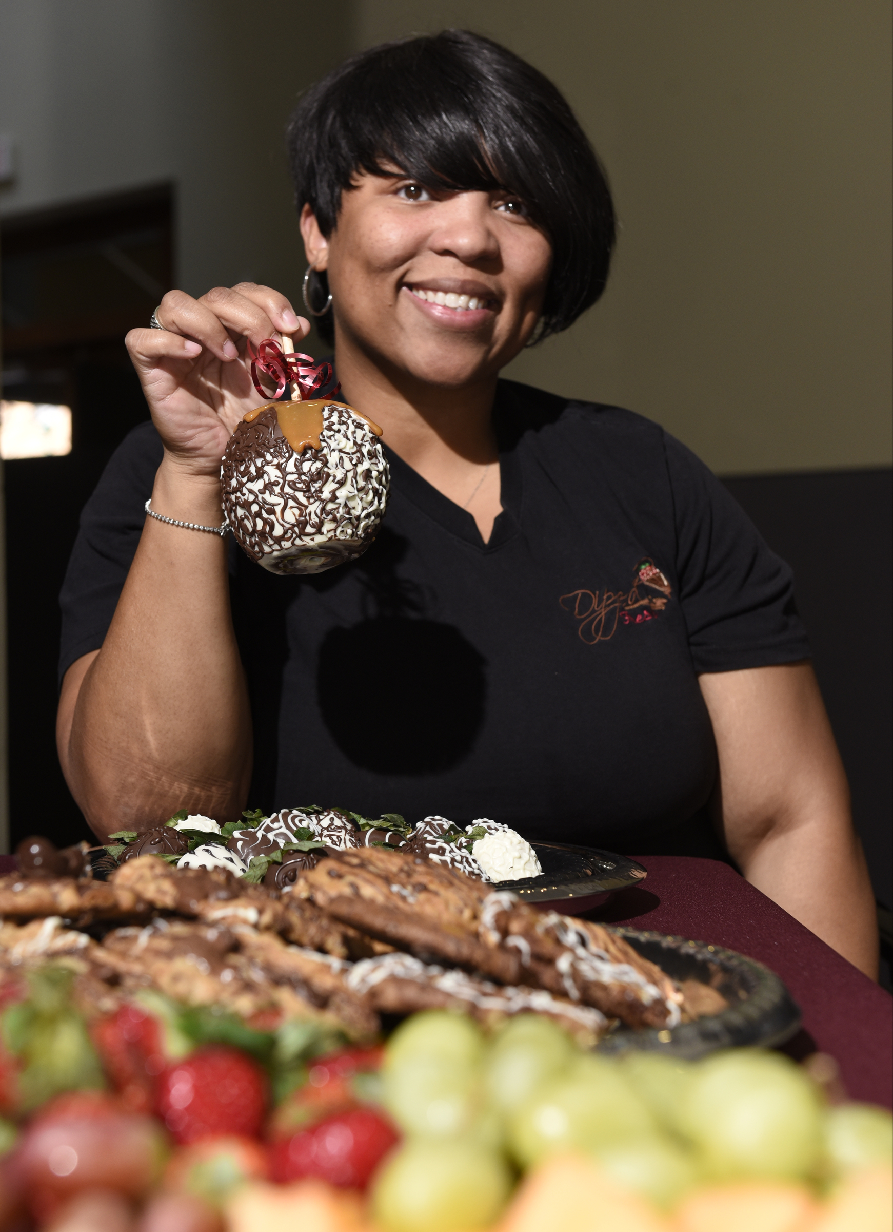 Antonia Poland, who founded Dipped Fresh along with Cynthia Wood, is photographed with some of her company's delicacies on Wednesday, Jan. 28, 2016, in Chattanooga, Tenn.,