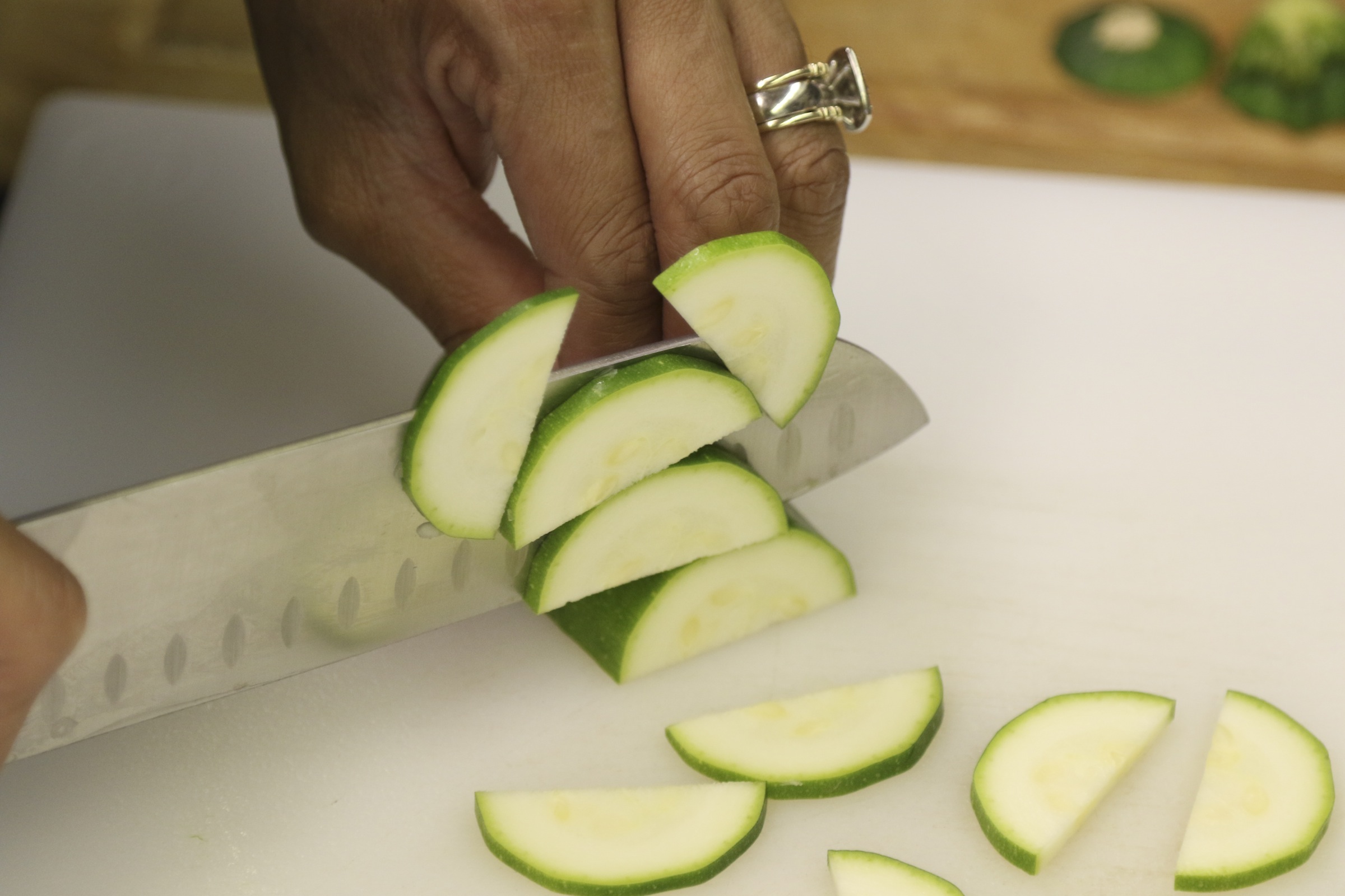 Staff Photo by Dan Henry / The Chattanooga Times Free Press- 1/13/17. Andi Cagle, executive chef and owner of Kozy Cooking, slices cucumbers while preparing for a catering event in Atlanta.