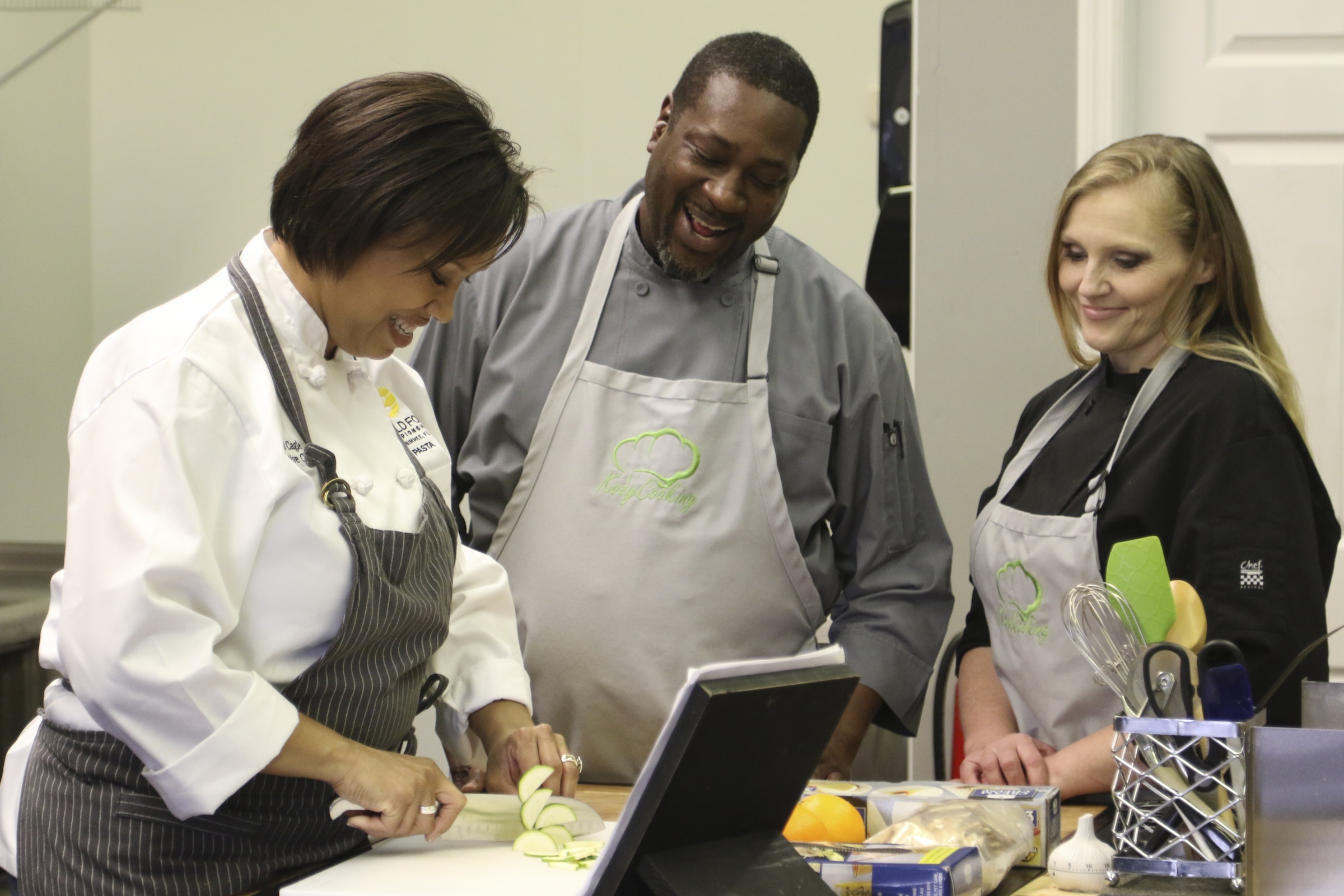 Staff Photo by Dan Henry / The Chattanooga Times Free Press- 1/13/17. Andi Cagle, executive chef and owner of Kozy Cooking, speaks to prep chef Renee Nichols and sous chef Cornelius McClain, from left, while preparing for a catering event in Atlanta.