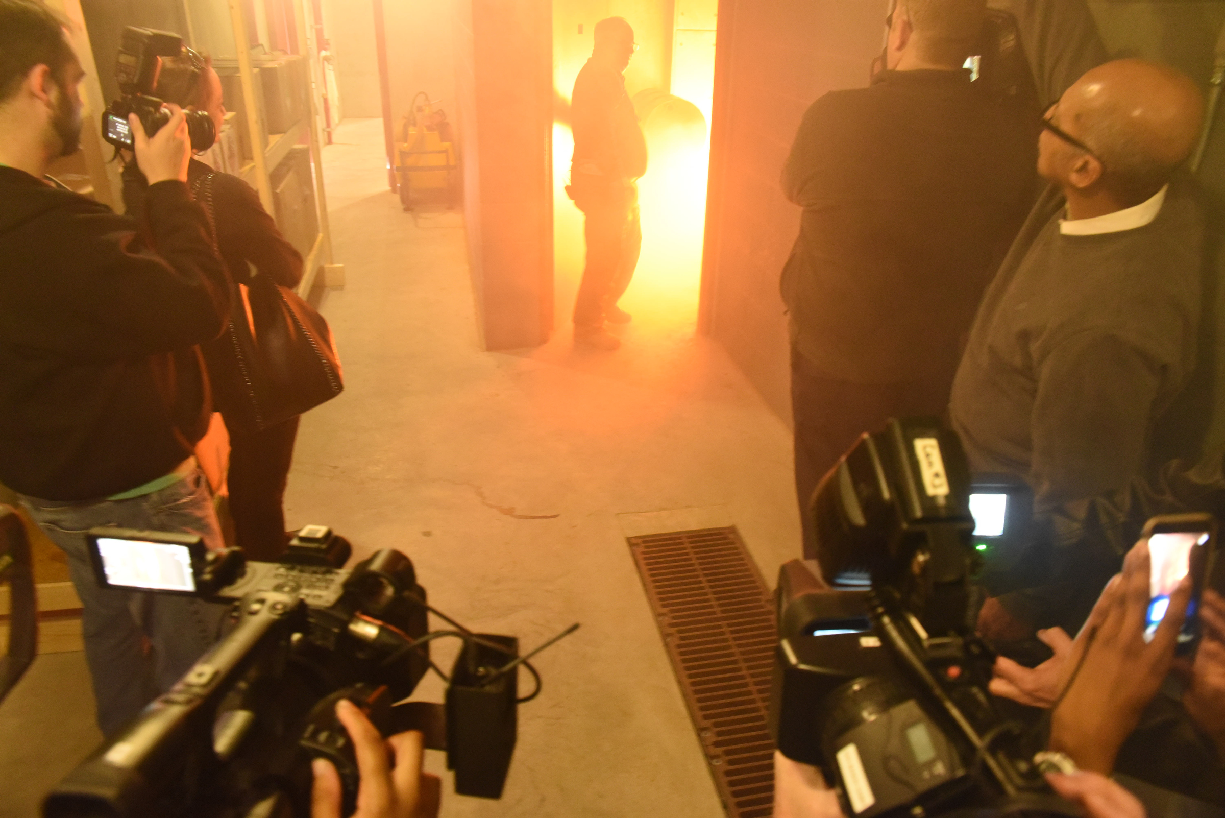 Phillip Johnson, manager of emergency response training at the Tennessee Valley Authority's Emergency Response Training Center, stands in the doorway of the cable spreading room and explains fighting an electrical fire inside the Marion County facility.