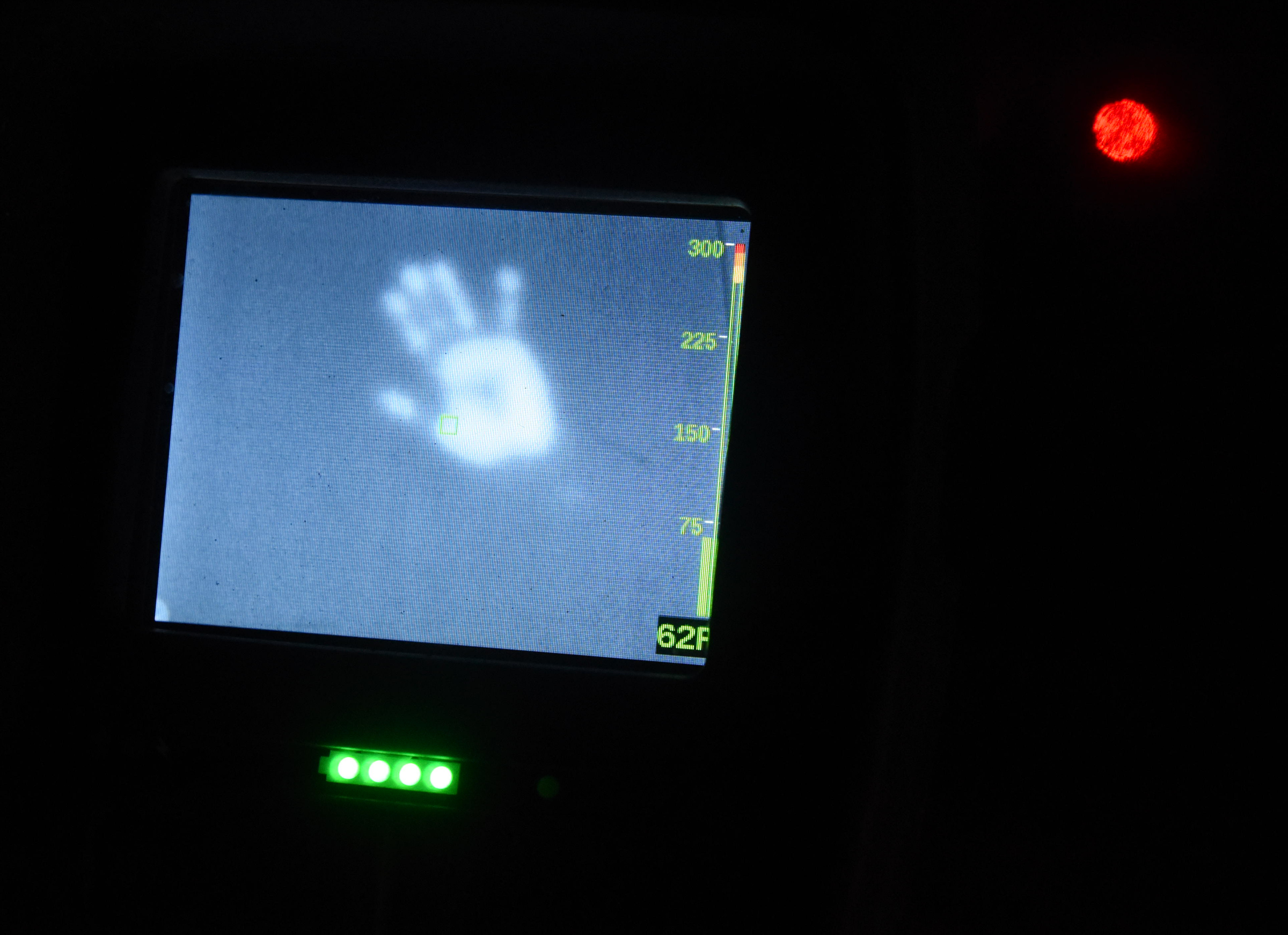 A red locater dot, and a hand print is seen on the wall at the Tennessee Valley Authority's Emergency Response Training Center as students use laser-guided, hand-held heat-measuring devices to find (pretend) victims while fire fighting.