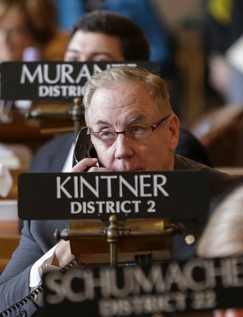 
              In this Jan. 4, 2017, photo, Nebraska state Sen. Bill Kintner of Papillion talks on the phone in the legislative Chamber on the first day of the 2017 legislative session, in Lincoln, Neb. Sen. Kintner could face expulsion from the Legislature for retweeting a talk show host's joke implying that Women's March demonstrators are too unattractive to sexually assault. Kintner's fellow lawmakers railed Tuesday, Jan. 24, 2017, against him in response to public outrage over his online posting, the latest in a long history of inflammatory statements. (AP Photo/Nati Harnik)
            
