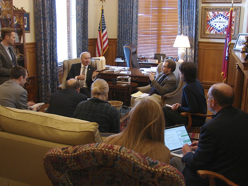 
              Gov. Asa Hutchinson visits with reporters at his State Capitol office in Little Rock, Arkansas, on Thursday, Jan. 26, 2017, to discuss a bill limiting a common second-trimester abortion procedure. The Arkansas Senate gave the bill final approval Thursday, and Hutchinson said he would sign the bill when it arrives in his office. (AP Photo/Kelly P. Kissel)
            
