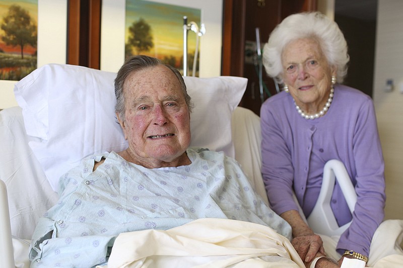
              In this photo provided by Office of George H.W. Bush on Monday Jan. 23, 2017, former President George H.W. Bush and his wife Barbara pose for a photo at Houston Methodist Hospital in Houston. The 92-year-old former president is still suffering from pneumonia, but is well enough to leave the intensive care unit at a Houston hospital, doctors said Monday. His wife, Barbara, has been discharged from the same facility after completing treatment for bronchitis. (Courtesy the Office of George H.W. Bush via AP)
            