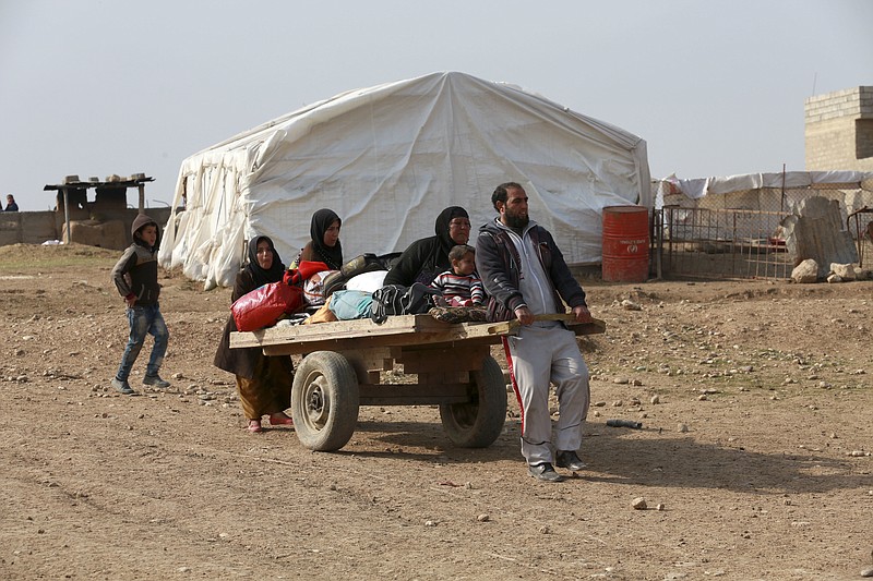 
              Civilians flee their villages due to fighting between Iraqi security forces and Islamic State militants, on the outskirts of Mosul, Iraq, Thursday, Jan. 26, 2017. (AP Photo/Khalid Mohammed)
            