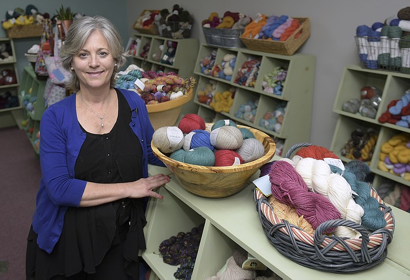Elizabeth Poe poses in her store, The Joy of Knitting, Wed., Jan. 25, 2017, in Franklin, Tenn. Poe asked that customers go elsewhere if they want knitting supplies for the recent women's marches in which many participants wore knitted pink hats. Poe made a social media post saying the "vulgarity, vile and evilness" of the women's movement is "absolutely despicable." She framed her comments around Saturday's massive women's march in Washington. (Shelley Mays/The Tennessean via AP)