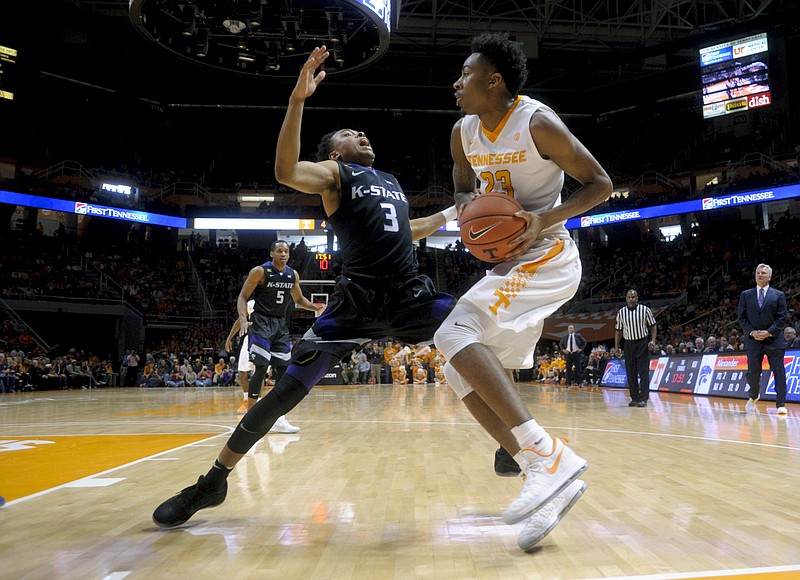 Kansas State's Kamau Stokes (3) defends against Tennessee's Jordan Bowden (23) during an NCAA SEC-Big 12 basketball game between Tennessee and Kansas State at Thompson-Boling Arena in Knoxville, Tenn., on Saturday, Jan. 28, 2017. (Calvin Mattheis/Knoxville News Sentinel via AP)
