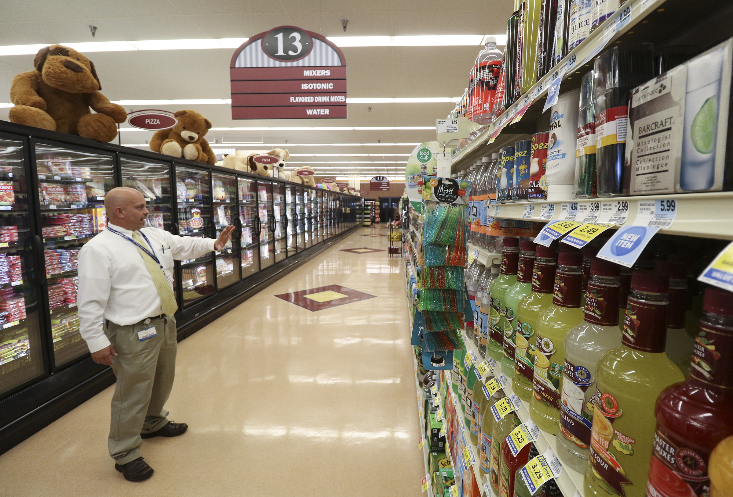 Staff Photo by Dan Henry / The Chattanooga Times Free Press- 10/13/16. David Smith, store manager of Food City 738 in Soddy-Daisy, speaks about the area he has designated to display wine if sales are approved while walking through his grocery store on October, 13, 2016.