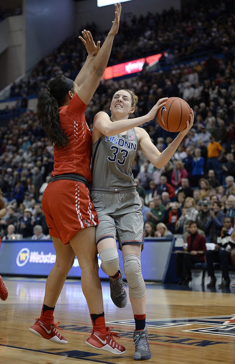 
              Connecticut's Katie Lou Samuelson drives around Houston's Brianne Coffman, left, in the half of an NCAA college basketball game, Saturday, Jan. 28, 2017, in Hartford, Conn. (AP Photo/Jessica Hill)
            