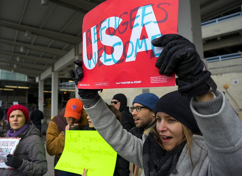 
              Protesters assemble at John F. Kennedy International Airport in New York, Saturday, Jan. 28, 2017 after two Iraqi refugees were detained while trying to enter the country. On Friday, Jan. 27, President Donald Trump signed an executive order suspending all immigration from countries with terrorism concerns for 90 days. Countries included in the ban are Iraq, Syria, Iran, Sudan, Libya, Somalia and Yemen, which are all Muslim-majority nations. (AP Photo/Craig Ruttle)
            