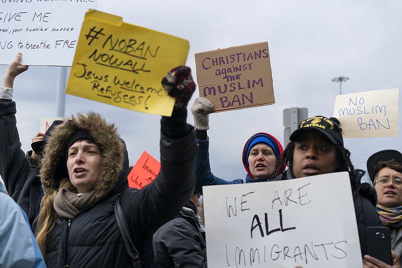 Protesters assemble at John F. Kennedy International Airport in New York, Saturday after two Iraqi refugees were detained while trying to enter the country. On Friday, President Donald Trump signed an executive order suspending all immigration from countries with terrorism concerns for 90 days. Countries included in the ban are Iraq, Syria, Iran, Sudan, Libya, Somalia and Yemen, which are all Muslim-majority nations. (AP Photo/Craig Ruttle)