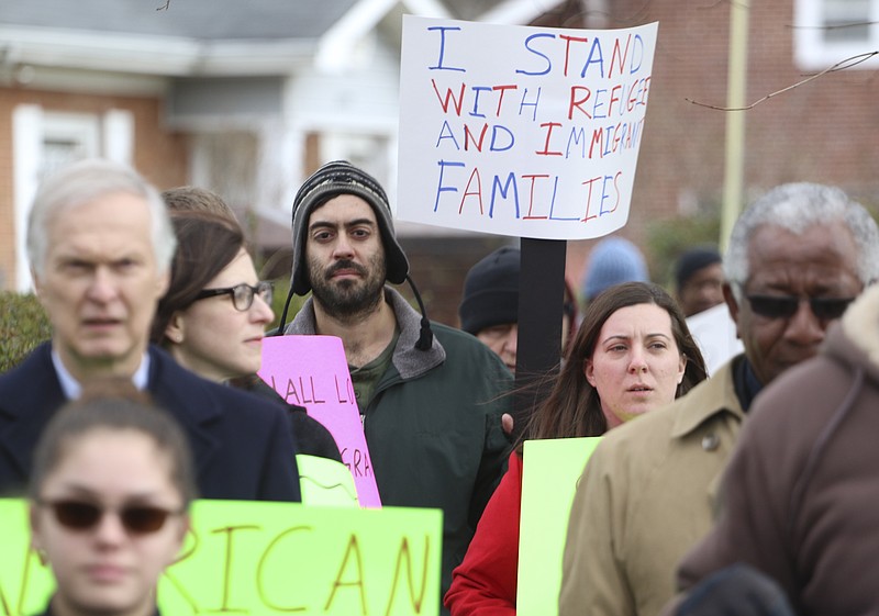 Pilgrim Congregational Church congregants march down 3rd Street on Sunday in Chattanooga to protest President Trump's executive order on immigration.