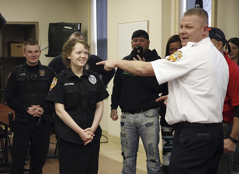
              Alyssa Elkins, 16, left, learns to use a Taser at the Newark Police headquarters on Sunday, Jan. 29, 2017. Police helped Elkins, a teenage leukemia patient cross off a bucket-list item that was seriously shocking: She wanted to use a stun gun on someone. (Alan Miller/The Columbus Dispatch via AP)
            