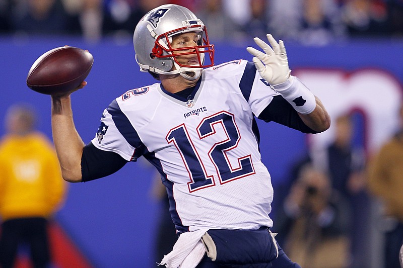 New England Patriots quarterback Tom Brady throws a pass against the New York Giants during the second half of an NFL football game Sunday Nov. 15, 2015, in East Rutherford, N.J. The Patriots won 27-26. (AP Photo/Gary Hershorn)