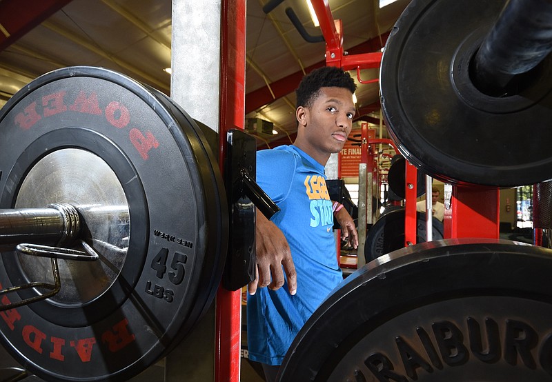 Baylor junior Brendon Harris, 17, works out in the school weight room on Monday. Harris should be one of next year's top prep football college prospects.