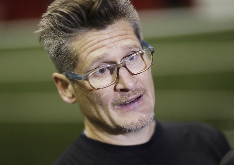 
              This Jan. 27, 2017 photo shows Atlanta Falcons general manager Thomas Dimitroff answering questions from the media at the NFL football team's practice facility in Flowery Branch, Ga. A string of emails that began in 2010 with the Atlanta Falcons head trainer and reached all the way to owner Arthur Blank showed a franchise worried about its ”excessive” reliance on painkillers to treat players and the potential embarrassment that could cause the team and the NFL. Nearly every recipient on the email chain _ from Blank, president Rich McKay and general manager Thomas Dimitroff to then-head athletic trainer Marty Lauzon _ is still with the team, which plays New England in the Super Bowl on Sunday. (AP Photo/David Goldman)
            