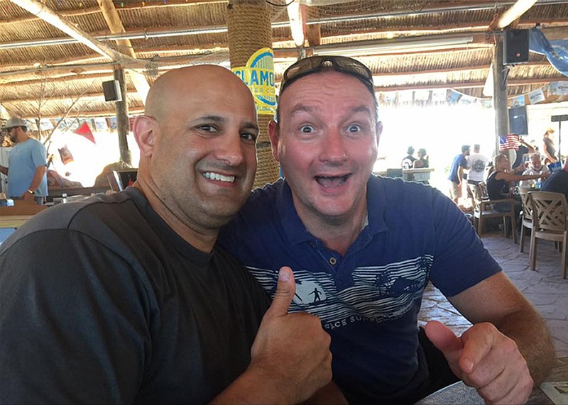 
              In this screen grab of a photo from a Facebook posting, Col. Victor Garcia, left, who served as the senior officer overseeing CENTCOM’s counter-propaganda program from 2013 to mid-2016, poses on vacation with his friend Simon Bergman at Gilbert’s Resort in Key Largo, Fla. The photo was removed from Facebook shortly after it was posted on Sept. 16, 2016.  Two weeks later, a $500 million contract was awarded to a team of companies that included Bergman’s firm M&C Saatchi. A whistleblower complaint filed with Central Command’s inspector general said the photo created a “clear impression and perception of impropriety.” (AP Photo)
            