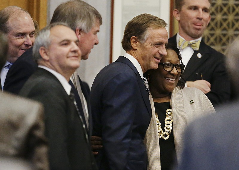 Tennessee Gov. Bill Haslam poses for a picture with Rep. Karen Camper, D-Memphis, before giving his annual State of the State address to a joint convention of the Tennessee General Assembly Monday, Jan. 30, 2017, in Nashville, Tenn. (AP Photo/Mark Humphrey)