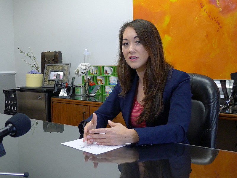 
              Rep. Beth Fukumoto talks with reporters in her capitol office on Wed., Feb. 1, 2017 in Honolulu. In deep-blue Hawaii, Fukumoto is considering switching parties to become a Democrat after she was pressured to resign her leadership role for criticizing President Donald Trump.  (AP Photo/Cathy Bussewitz)
            