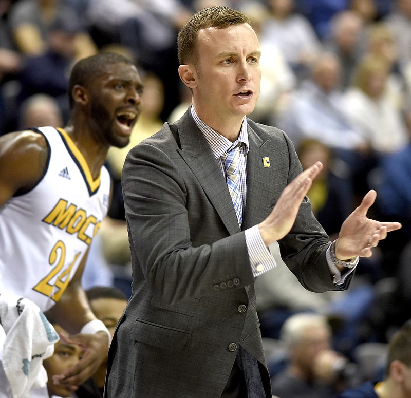 UTC men's basketball coach Matt McCall and senior Casey Jones encourage the Mocs during a home game last month. The team is back at McKenzie Arena tonight for a 7:30 game against UNC Greensboro.