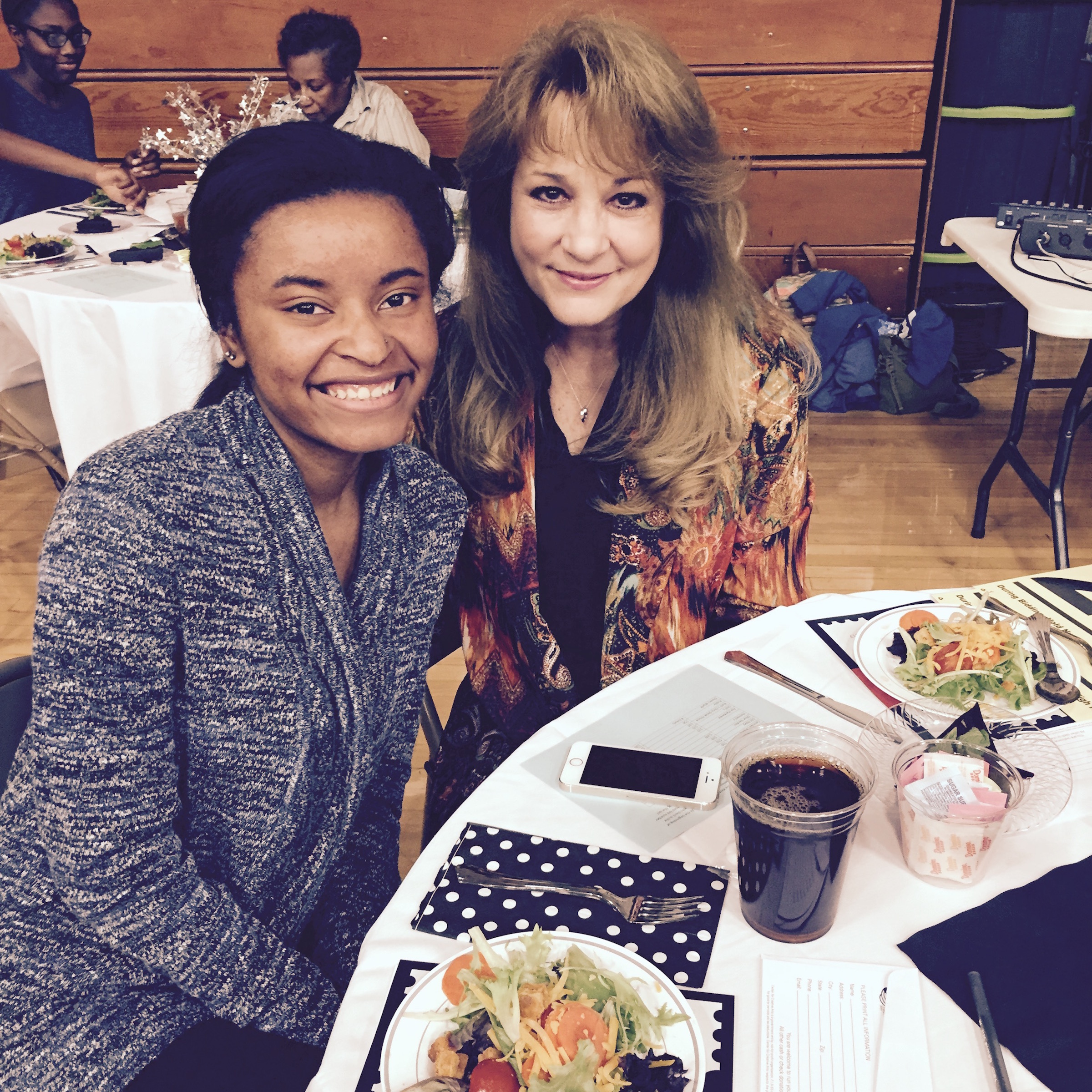 Dori Lyles, left, and Sarah Lyles wait for dinner to begin.