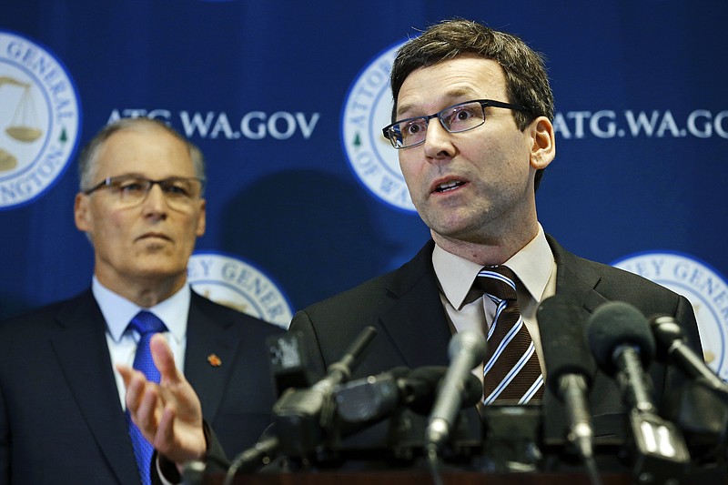 
              FILE - In this Jan. 30, 2017 file photo, Washington Attorney General Bob Ferguson, right, speaks in Seattle as Gov. Jay Inslee, left, looks on, during a news conference.  Ferguson announced that he is suing President Donald Trump over an executive order that suspended immigration from seven countries with majority-Muslim populations and sparked nationwide protests. A hearing is scheduled Friday, Feb. 3, 2017. (AP Photo/Ted S. Warren, File)
            