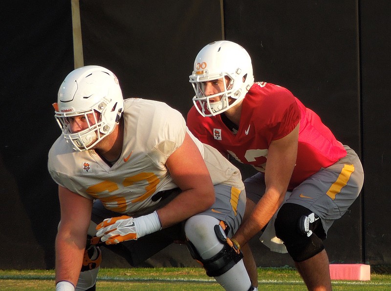 Tennessee backup quarterback Quinten Dormady prepares to take a snap from Brett Kendrick during a November practice.