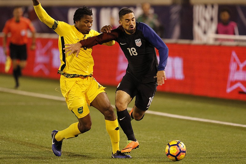 Jamaica defender Alvas Powell (5) paces USA midfielder Sebastian Lletget (18) as he makes a run for a corner during the United States men's national soccer team's exhibition match against Jamaica at Finley Stadium on Friday, Feb. 3, 2017, in Chattanooga, Tenn.
