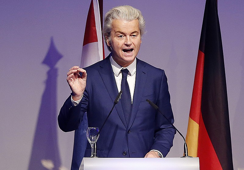 
              FILE - In this Saturday, Jan. 21, 2017 file photo, Dutch populist anti-Islam lawmaker Geert Wilders delivers a speech at a meeting of European Nationalists in Koblenz, Germany.  Wilders clashed in the Dutch Parliament Tuesday, Jan. 31, 2017 with the Dutch foreign minister over U.S. President Donald Trump's travel ban for people from seven Muslim nations. (AP Photo/ Michael Probst, file)
            