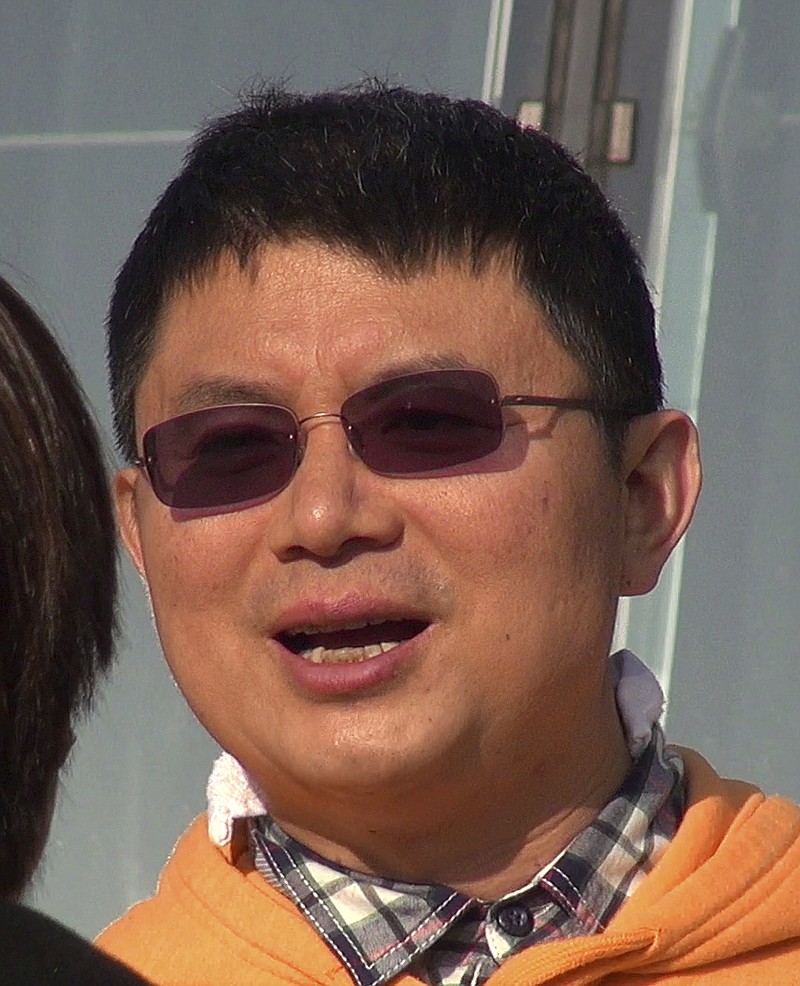 
              In this Dec. 2013, photo, Xiao Jianhua, a Chinese-born Canadian billionaire talks to reporter outside the International Finance Centre in Hong Kong. Mystery surrounds the whereabouts of Xiao reportedly taken away from his Hong Kong hotel by mainland police in a case that could rekindle concerns about overreach by Chinese law enforcement in the semiautonomous city. (Next Magazine via AP)
            