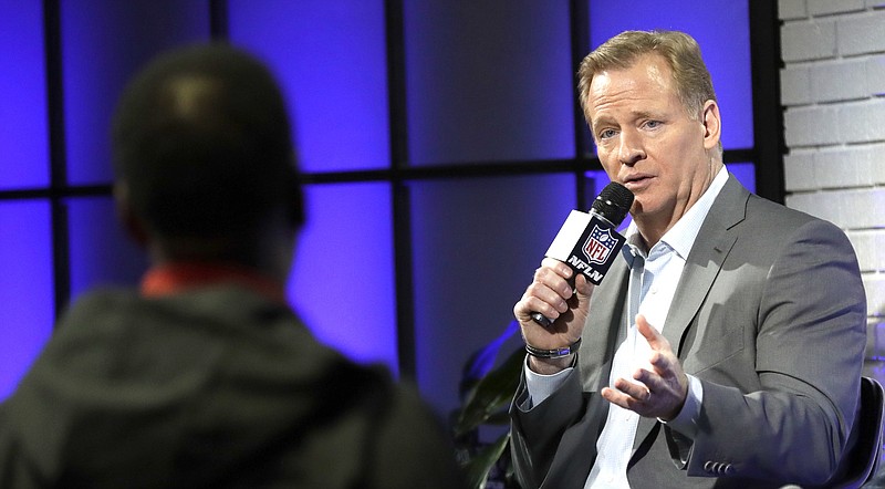 NFL Commissioner Roger Goodell, right, answers a question from a fan about marijuana use during a fan forum for the NFL Super Bowl 51 football game Friday, Feb. 3, 2017, in Houston. (AP Photo/David J. Phillip)

