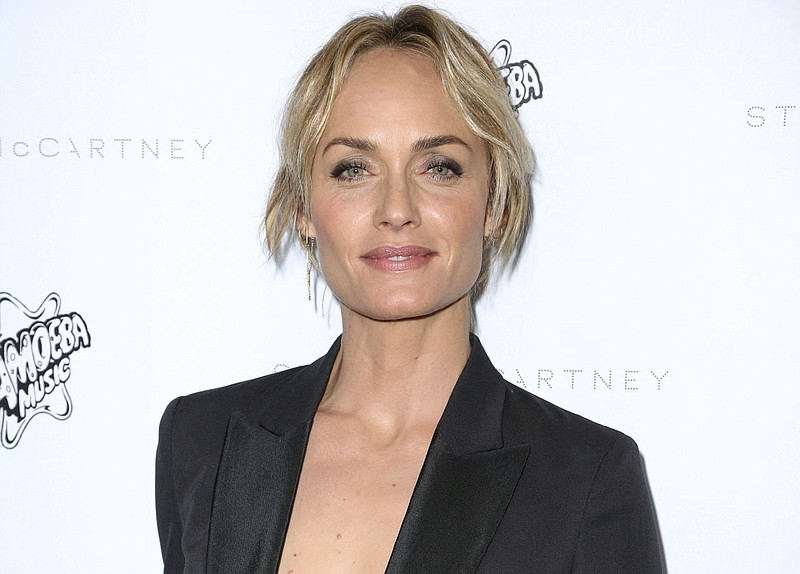 
              FILE - This Jan. 12, 2016 file photo shows Sierra Club Ambassador, model, actress and Oklahoma native Amber Valletta at the Stella McCartney Autumn 2016 Presentation in Los Angeles. Valletta authored a passionate op-ed piece released Friday, Feb. 3, 2017, on Glamour.com, opposing Oklahoma Attorney General Scott Pruitt's nomination to lead the Environmental Protection Agency.  (Photo by Rich Fury/Invision/AP, File)
            